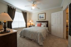 One Bedroom Apartments in SW Houston, Texas - Classic Model Bedroom with View to Bathroom
