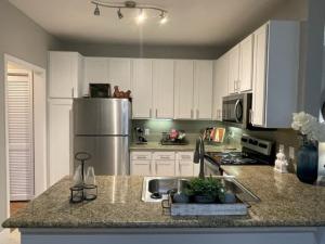 One Bedroom Apartments in Southwest Houston, Texas - Model Kitchen with Stainless-Steel Appliances